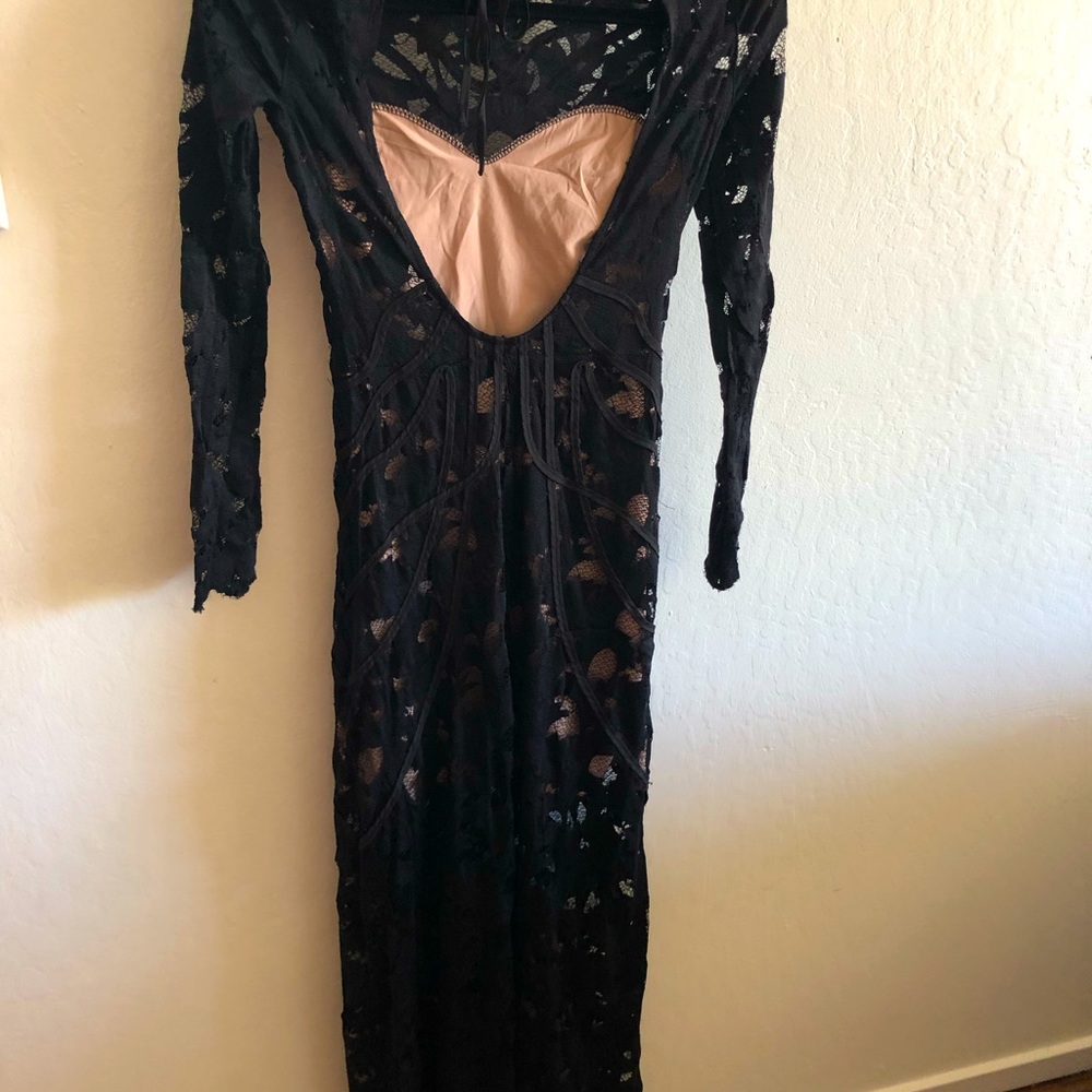 Black Fitted dress in black.Lace Opening at back.